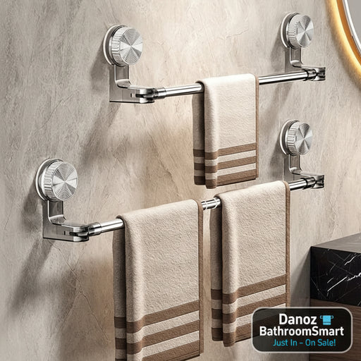 Towel racks with towels on a tiled bathroom wall