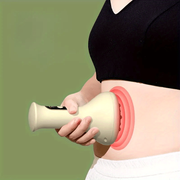 Person using a handheld device on their abdomen with a green background