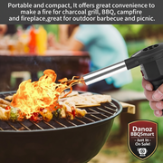 Portable fire starter being used to cook food on a grill outdoors.
