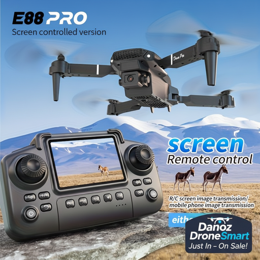 Drone with screen remote control device against a mountainous landscape background