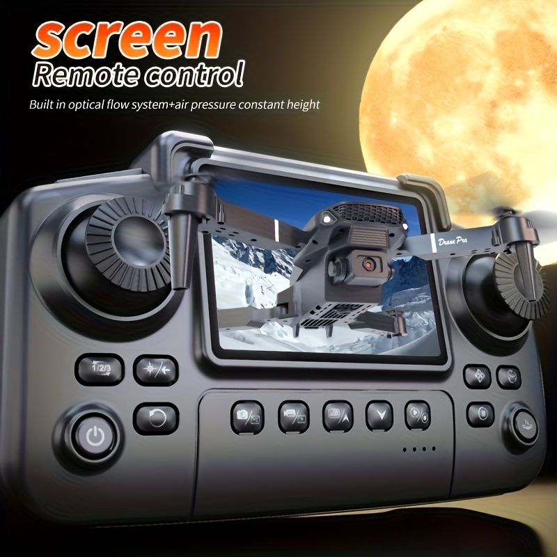 Remote control with screen displaying a snowy landscape, moon in the background