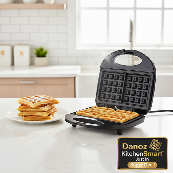 Black waffle maker with open lid showing grid pattern, next to its packaging on a white background