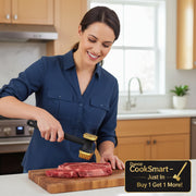 A black and gold meat tenderizer with a long handle and a textured head, shown on a plain white background.
