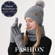 Person wearing a gray knit hat with pom-pom, scarf, and gloves with 'FASHION' text and quote.