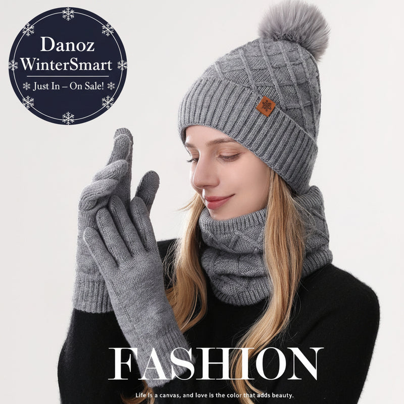 Person wearing a gray knit hat with pom-pom, scarf, and gloves with 'FASHION' text and quote.