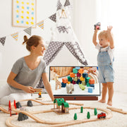 Woman and child playing with a wooden train set in a room with colorful decorations.