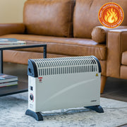 Convection heater on a carpeted floor with a brown leather sofa in the background