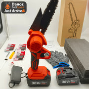 Electric chainsaw with accessories on a white surface