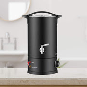 Black hot wax bottle on a kitchen counter with a blurred background