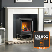 Modern electric stove with flames inside, placed on a decorative hearth in a room.