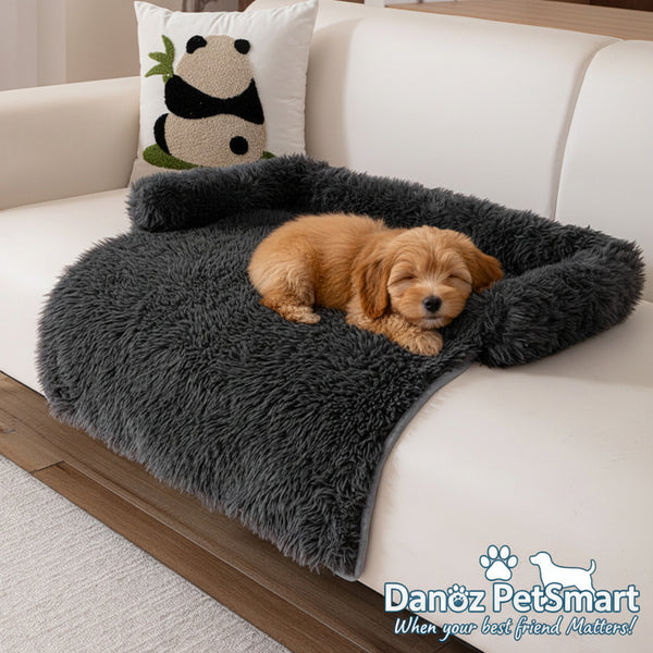 Gray fluffy blanket draped over a white sofa with a panda pillow.