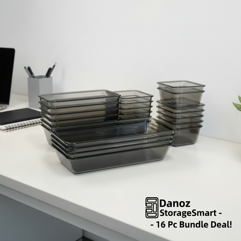 Set of black glass food containers with labels on a light gray background