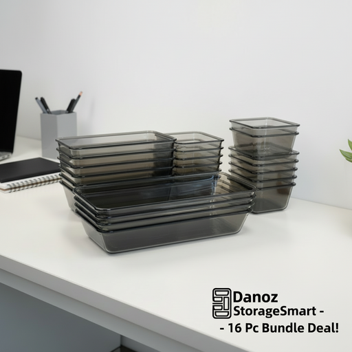 Set of black glass food containers with labels on a light gray background
