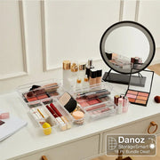 Makeup products on a vanity table with a round mirror