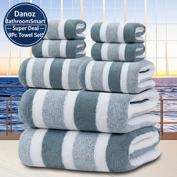 Stack of gray and white striped towels with a scenic background