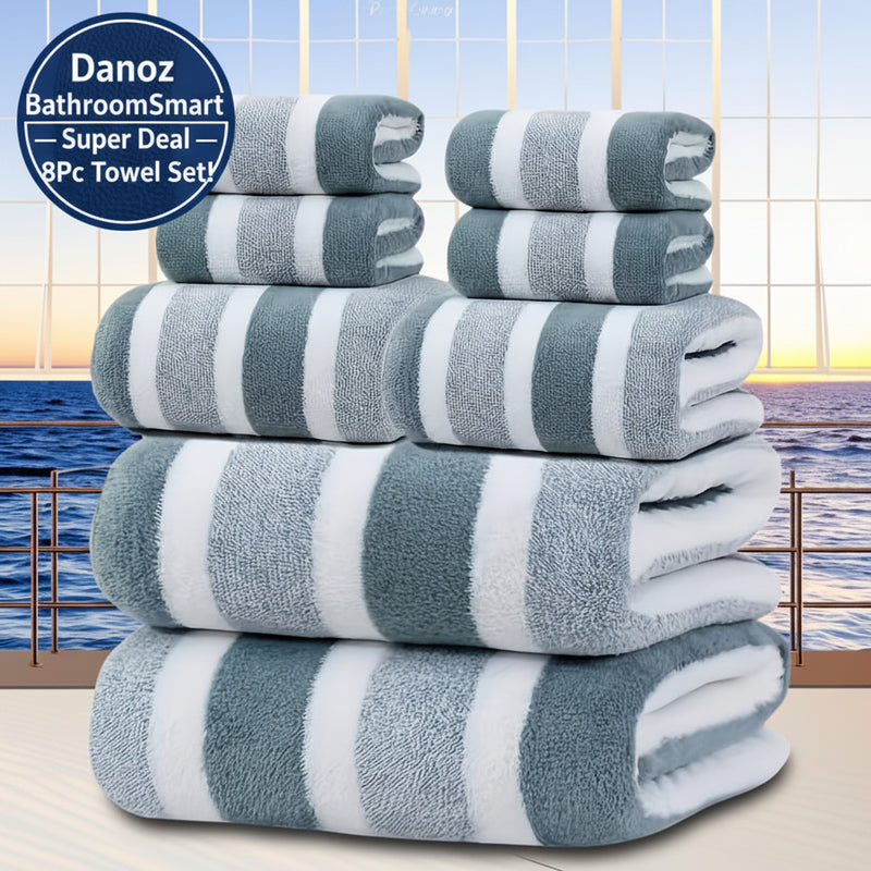 Stack of gray and white striped towels with a scenic background