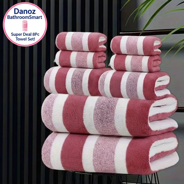 Stack of red and white striped towels on a black stand with a blurred background