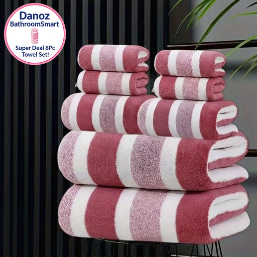Stack of red and white striped towels on a black stand with a blurred background