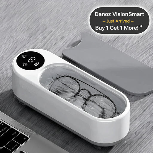 Eyeglasses in a white cleaning device on a wooden surface