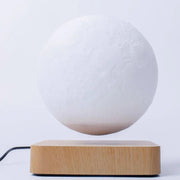 Illuminate your space with Danoz Levitating Moon Lamp, captivating night light that floats effortlessly above its base using magnetic levitation technology. - danozdirect