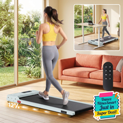 Woman retained in main walking and standing-desk inset views of green Everfit pad with vivid living-room background and colourful bottom-right FitnesSmart badge