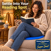 Woman using SeatSmart cushion in a reading chair