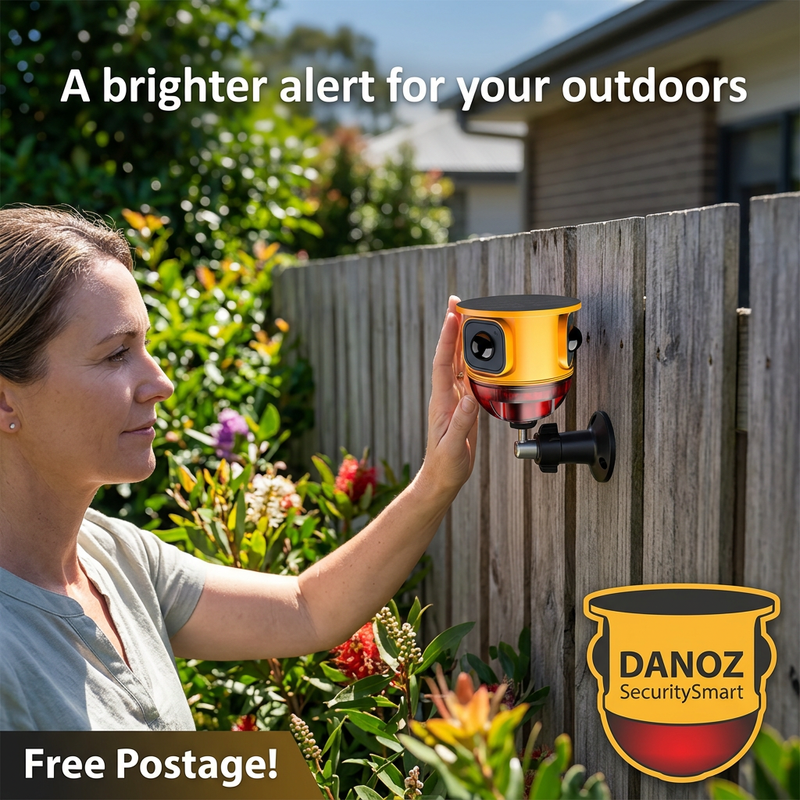 Danoz SecuritySmart yellow solar alarm installed on a garden fence with homeowner and Free Postage