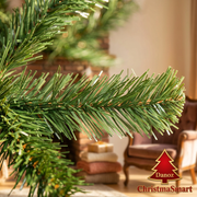 Close-up of green PVC tree needles in sunlit living room
