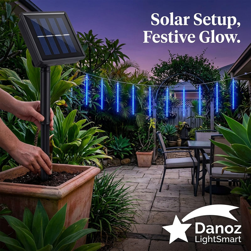 Hands placing solar panel stake in a planter beside blue lights