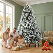 2.4m snow-flocked Christmas tree with family opening gifts in sage living room