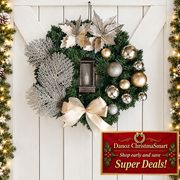 Champagne Christmas wreath on light wooden doorway
