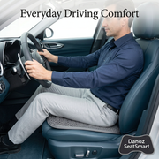 Driver seated on a grey SeatSmart honeycomb cushion
