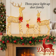 Three-piece gold LED reindeer family on a festive mantel
