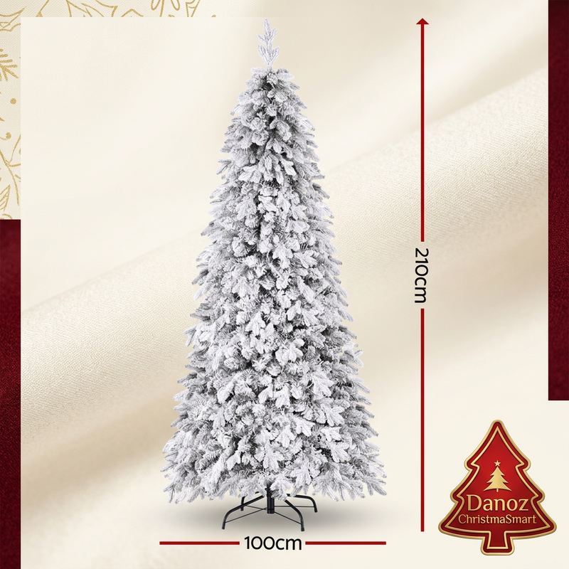 Snow-flocked tree dimensions 210cm tall and 100cm wide