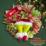 Close view of festive ribbon patterns, green plush legs and red shoes on the Christmas wreath
