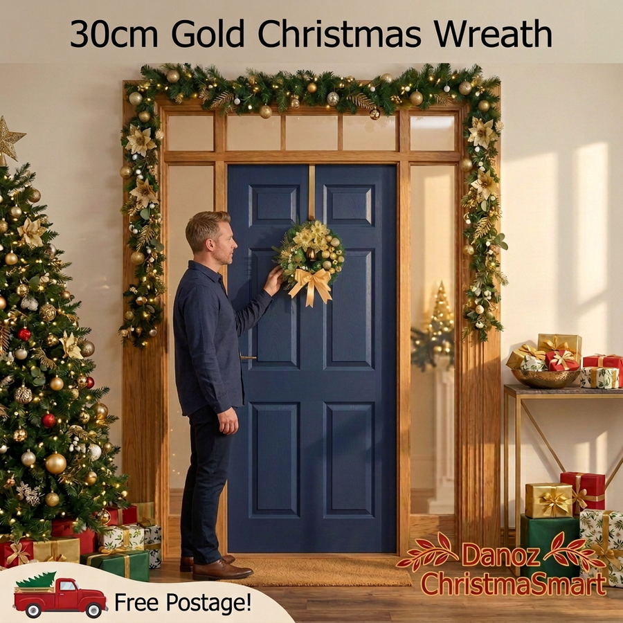 Man in a navy shirt arranging a compact gold Christmas wreath in a decorated doorway