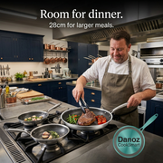 Man cooking steak and vegetables with a 28cm Danoz CookSmart frying pan on gas