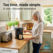 Older woman operating a compact 30cm InstaHotSmart dispenser beside a toaster, Free Postage