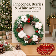 Christmas wreath pinecone, berry and white accent details on an oak console