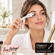 Adult woman using BeautySmart eyelash curler in bathroom