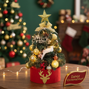 Close view of gold decorations and red reindeer base