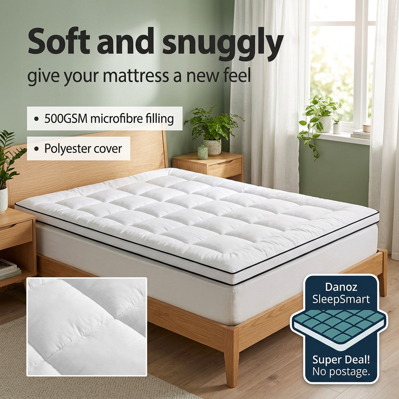 Giselle Queen mattress topper with black piping and microfibre detail in a fresh bedroom