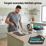 Man using the blue SteamSmart steam cleaner on a removed hob grate