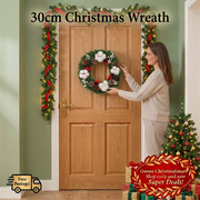 Woman arranging ChristmaSmart wreath in a Christmas entryway with garland, tree and presents
