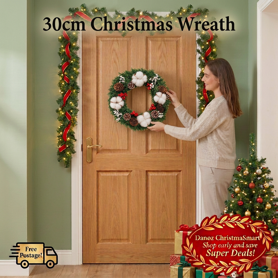 Woman arranging ChristmaSmart wreath in a Christmas entryway with garland, tree and presents