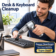 CleanSmart mini vacuum cleaning a keyboard