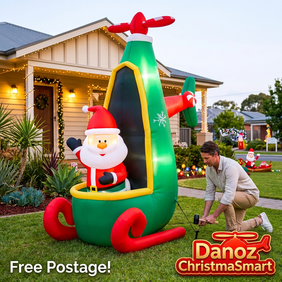 2.55m Santa helicopter inflatable with an adult securing its garden anchoring peg, Free Postage