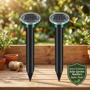 Danoz PestSmart two solar repeller stakes on a garden bench