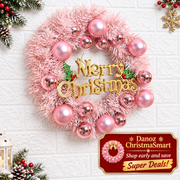 Pink wreath close view with gold Merry Christmas lettering