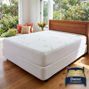 Danoz SleepSmart Queen protector in a vivid bedroom with bed-shaped branding